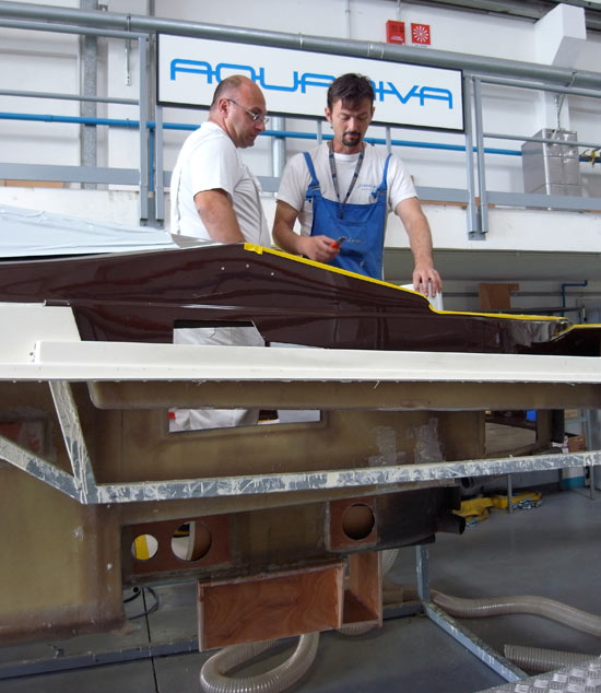 two riva workers assembling the ‘aquariva’