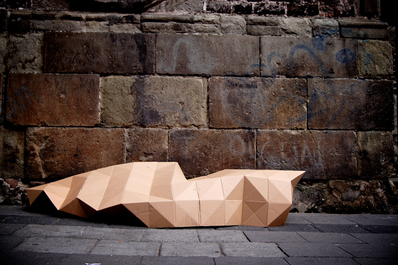 fernando resendiz folds cardboard into a homeless shelter