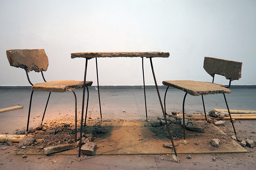 iftach gazit casts table and chair collection from a single slab of concrete