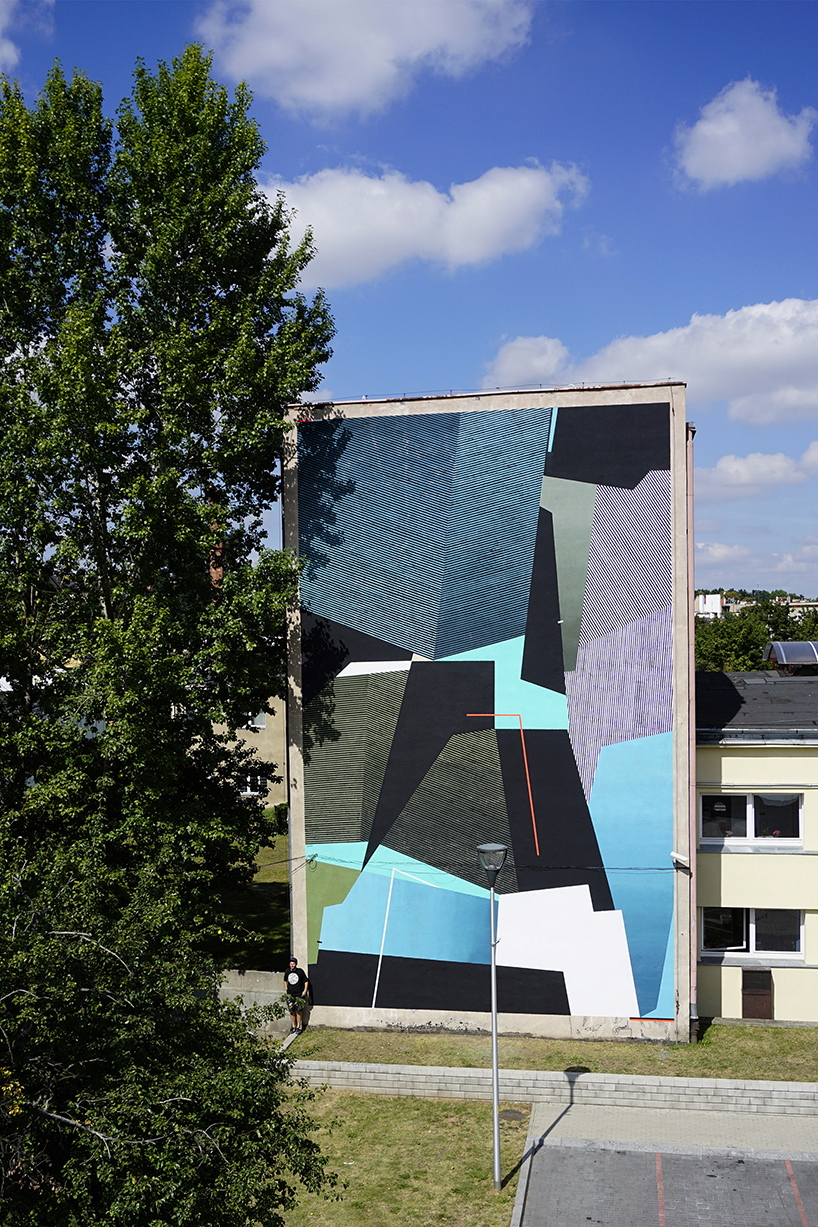 seikon creates vibrant mural painting on old balneotherapy center in świdnica, poland