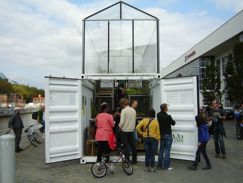 the shipping container base is outfitted with a greenhouse module 