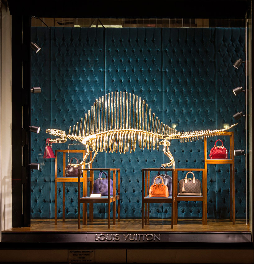 louis vuitton&#39;s gilded dinosaur skeleton window installation