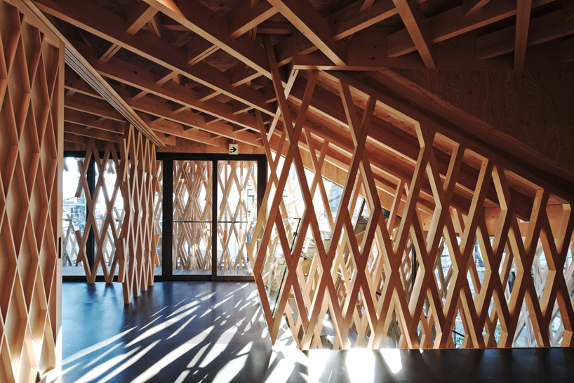 spaces formed by the wooden panels allow natural light to flow inside ...