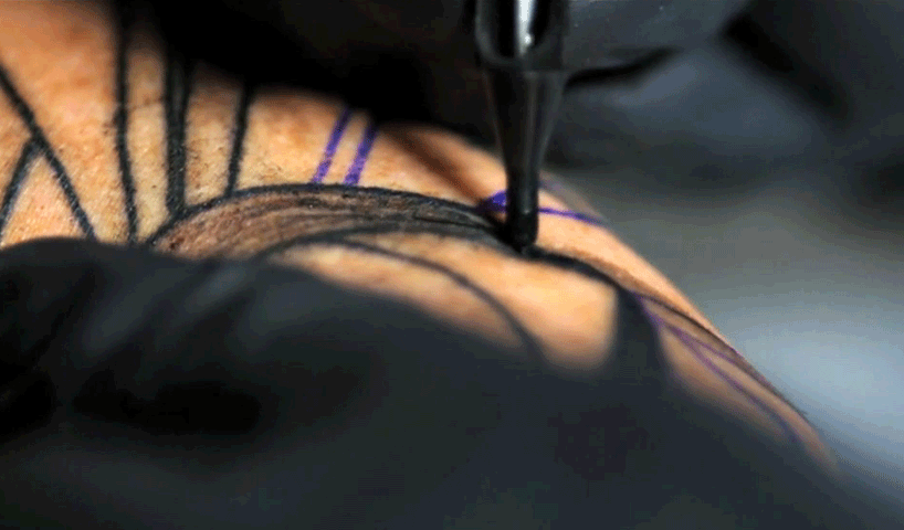 guet administers ink in mesmerizing slow motion tattoo footage