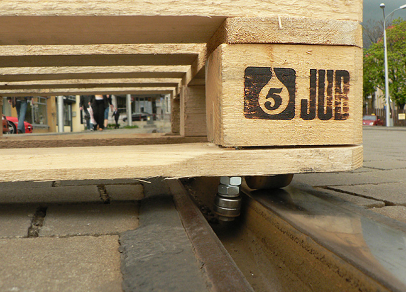 tomas moravec hacks a wooden pallet to glide down tram tracks