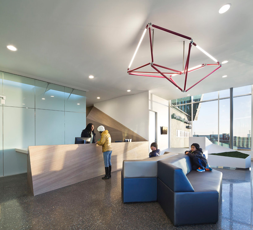 5G studio folds angular roof over legacy ER in allen texas