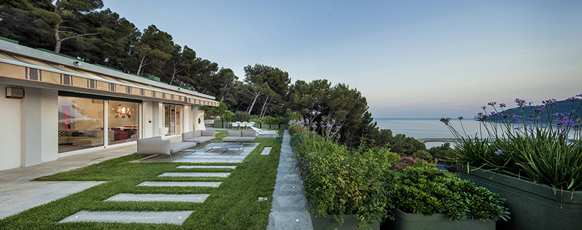 pinamare by building engineering renovates villas on italian beach