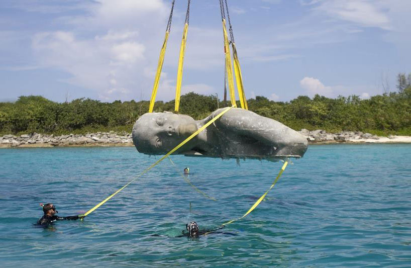 jason decaires taylor submerges ocean atlas sculpture in the bahamas