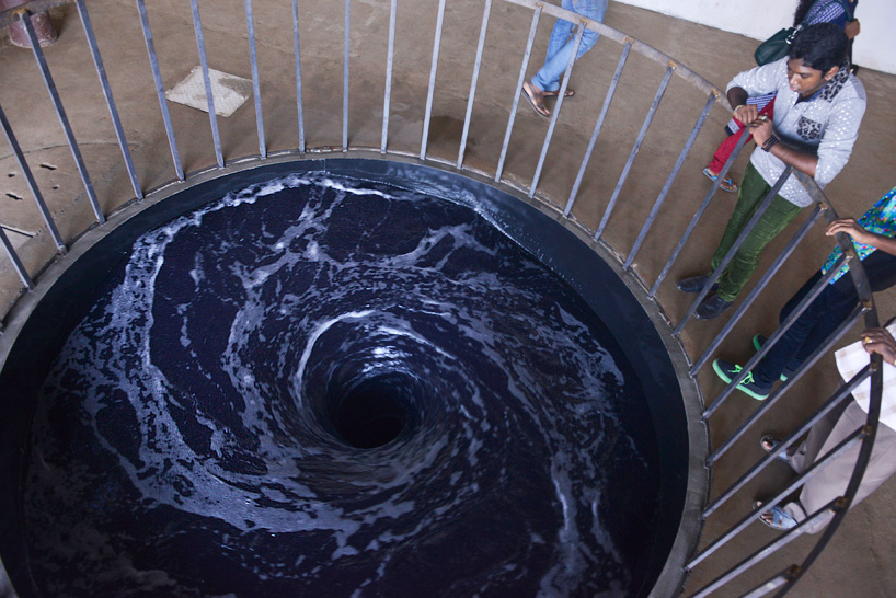 anish kapoor's black water vortex spins endlessly into gallery floor