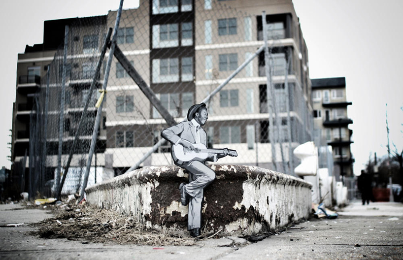 joe iurato adds miniature hand cut paper stencils to NYC streets