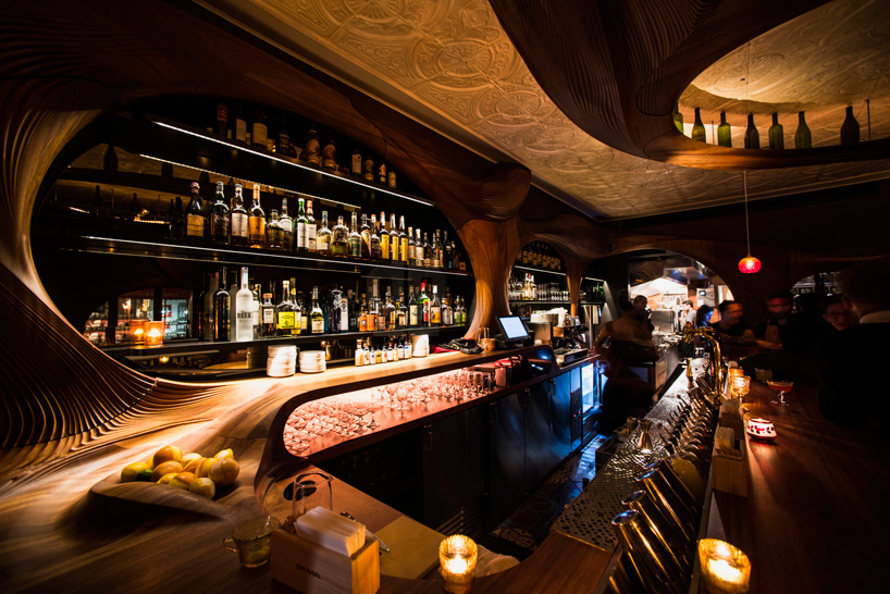 bar raval by partisans features carved mahogany interiors