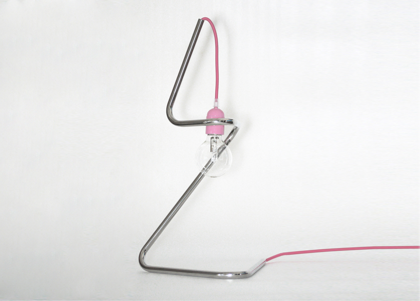 pietro travaglini creates tubino series of seemingly unstable lamps