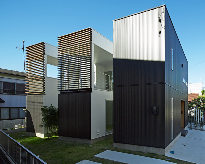 masao yahagi divides plot into three homes for family in japan