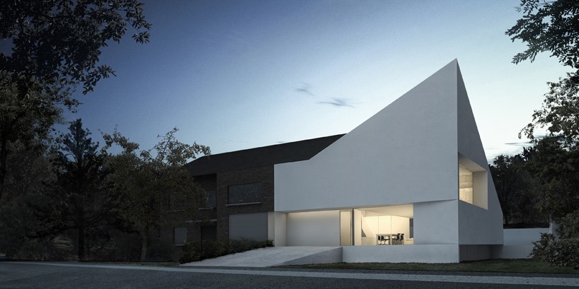 fran silvestre defines home extension with dramatic angular roofline in brussels