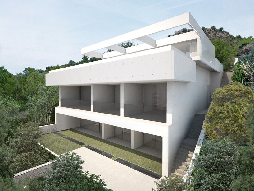 ramon esteve embeds monolithic quarry house into hillside in valencia