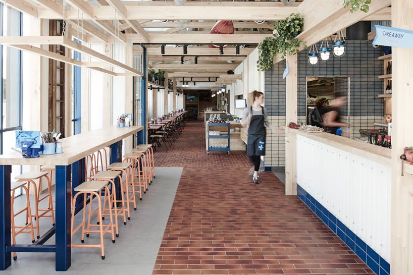 exposed timber frame highlights interior of techné's souvlaki restaurant