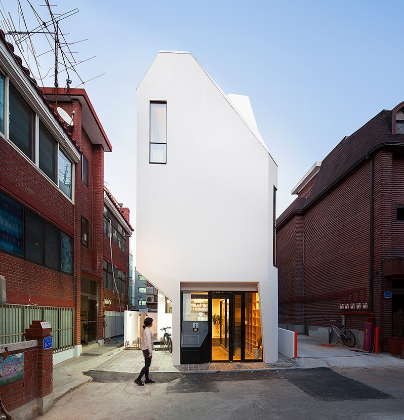 theplus architects defines seoul publisher's office with faceted white façade