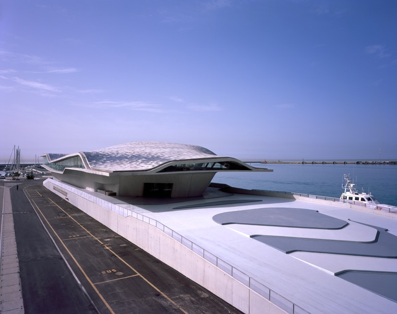 zaha hadid architect's ferry terminal in italy topped with asymmetric shell