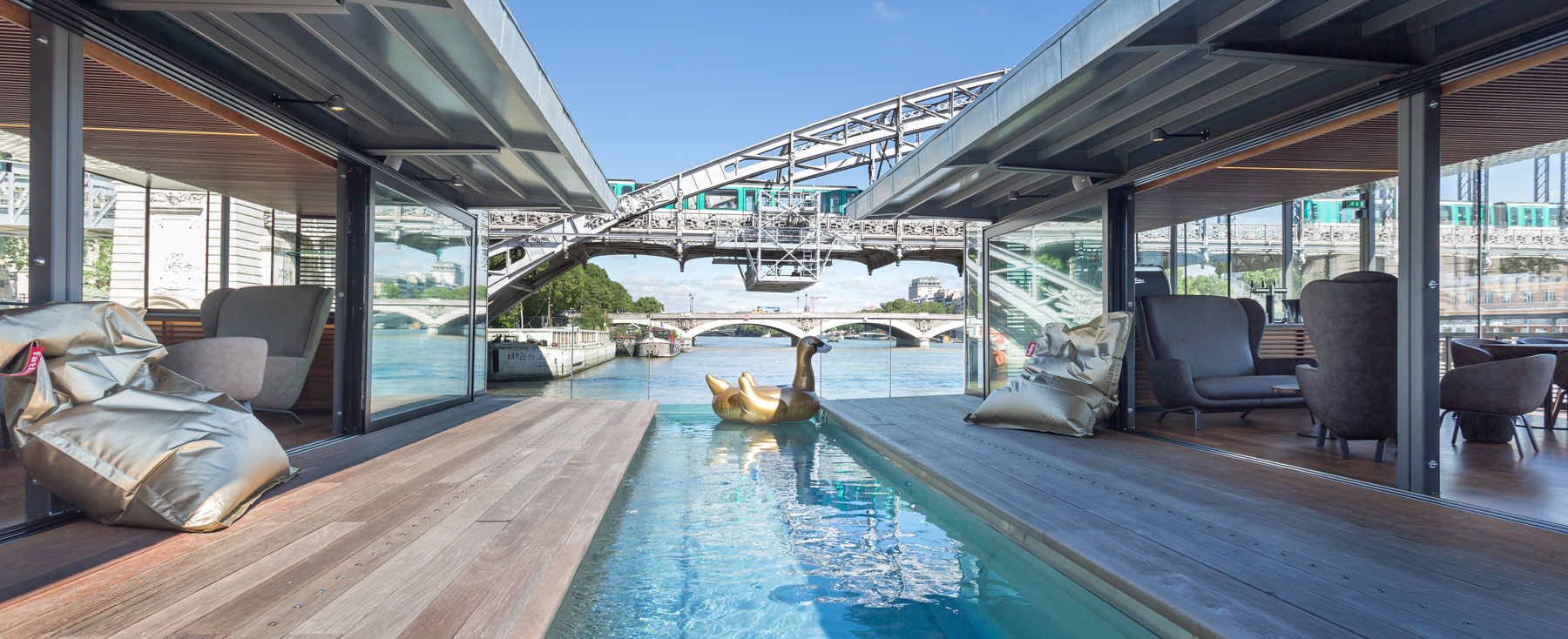 the floating OFF hotel docks by the riverbank of the seine in paris