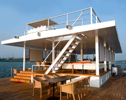 SDM architects restores a steel barge in india, into a floating restaurant