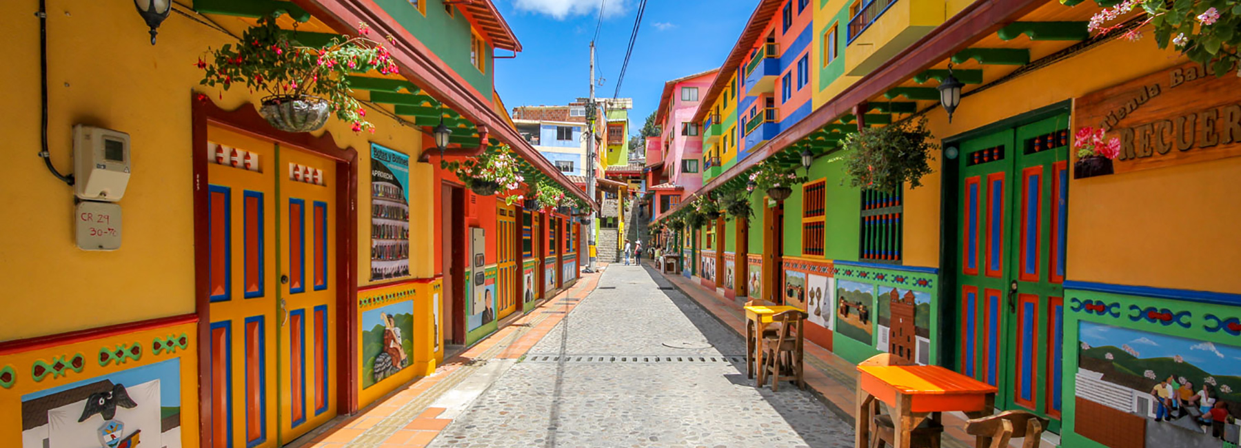 jessica devnani's saturated streetscapes capture colombia's colorful town of guatapé