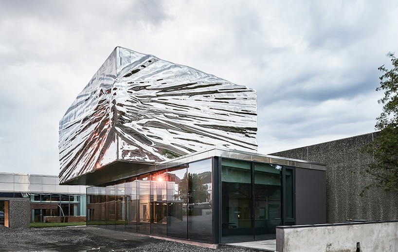 snøhetta cantilevers metallic steel extension in norwegian art museum