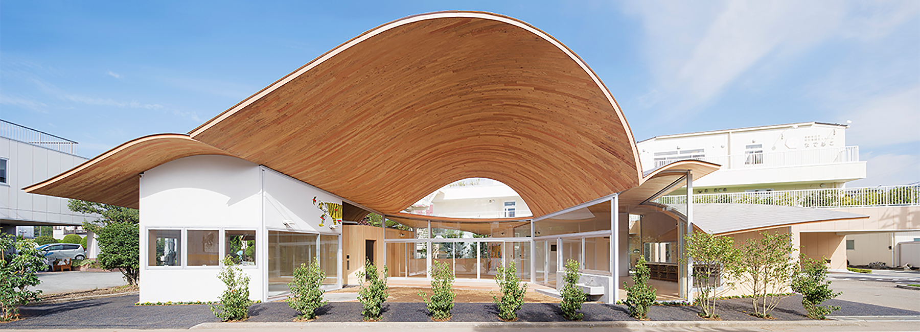 takashige yamashita tops small town nursery with a big roof in japan