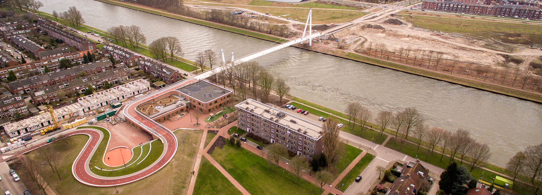 NEXT architects' utrecht bridge allows cyclists to bike over the roof of school