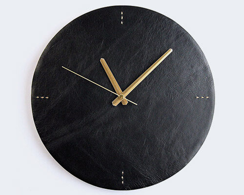 leather wall clock made from natural cow leather on the face and fixed with wooden back