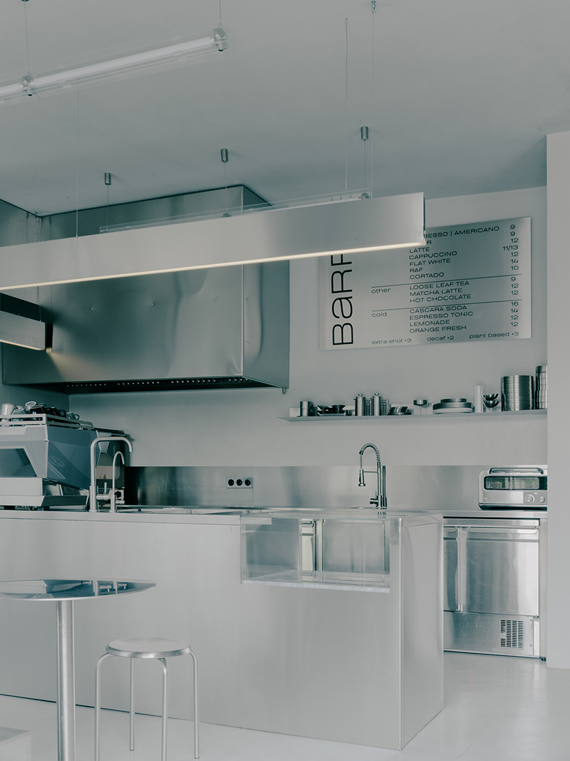 stainless steel and concrete build futuristic backdrop for tbilisi flower shop and cafe