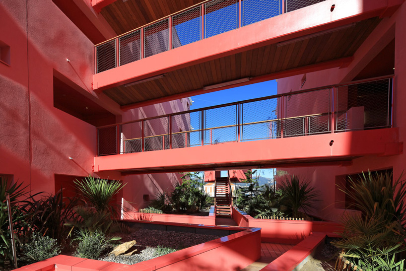 pietri architectes cuts canyon courtyard through redline apartments