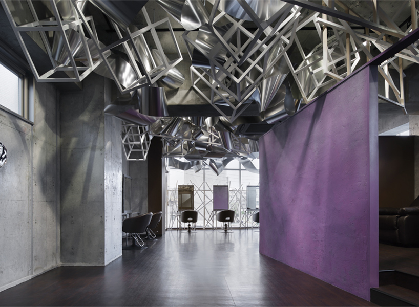 moriyuki ochiai designs beauty salon in tokyo with entwined layers