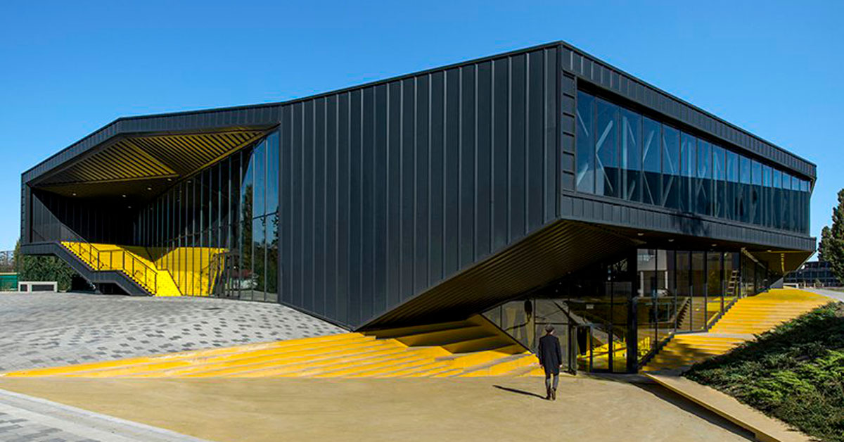 idis turato wraps yellow swimming complex interiors into black