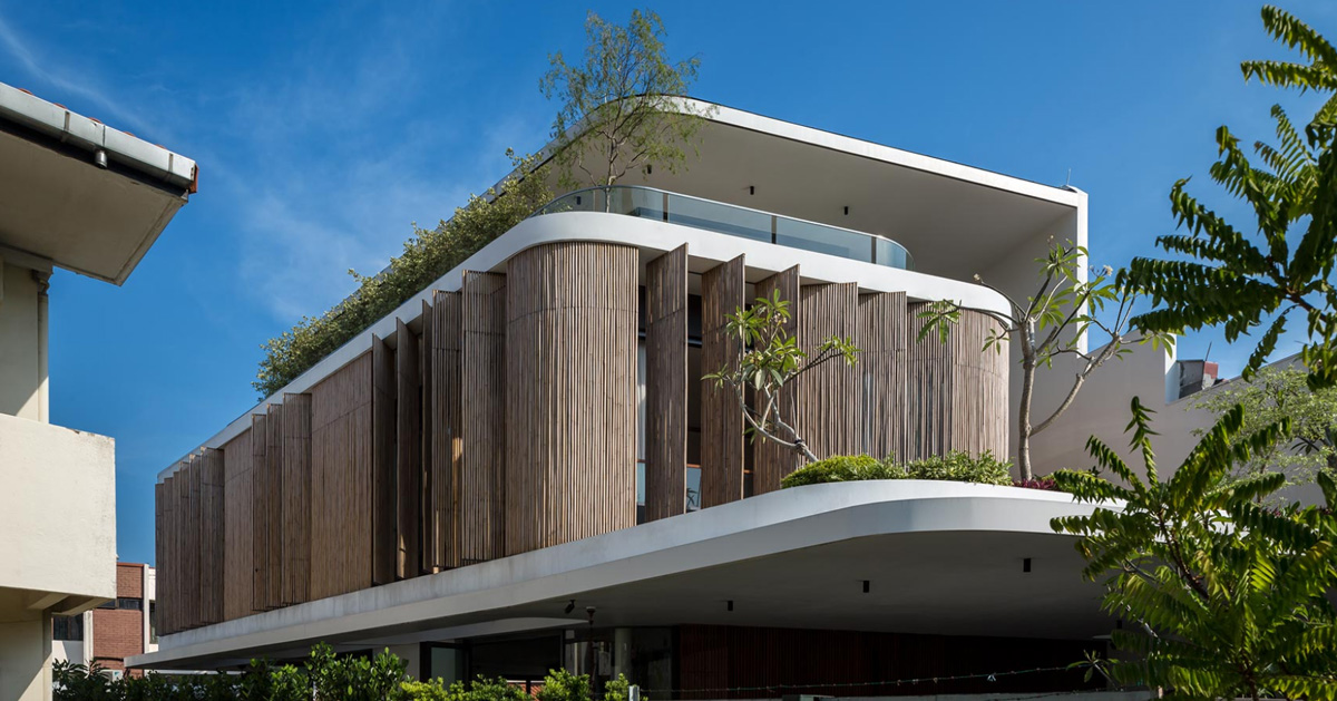 wallflower wraps house in singapore in a bamboo veil of operable screens
