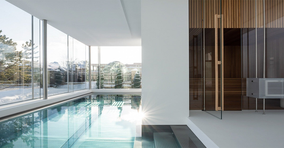 interior swimming pool by blockstudio emerges as a geometric addition ...