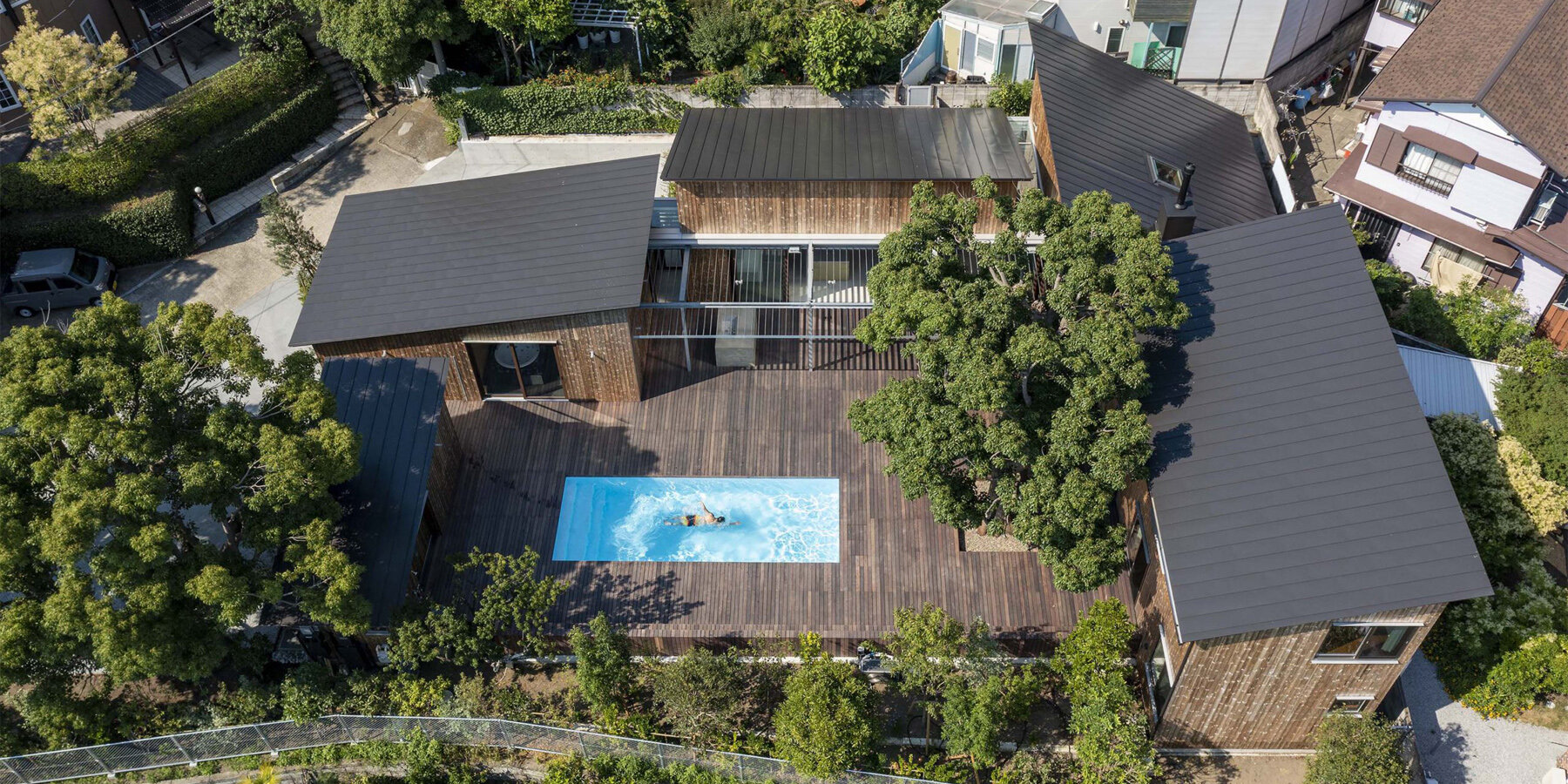key operation inc. composes private japanese residence as a cluster of wooden huts