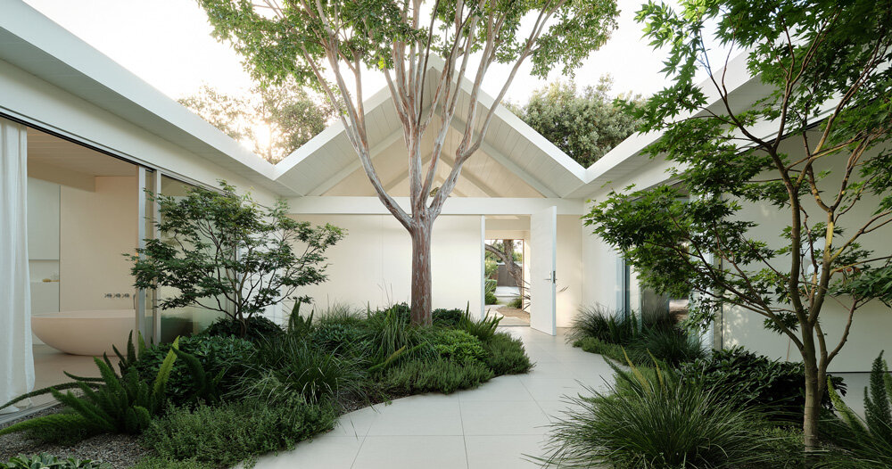 lush gardens permeate ryan leidner's minimalist twin gable house