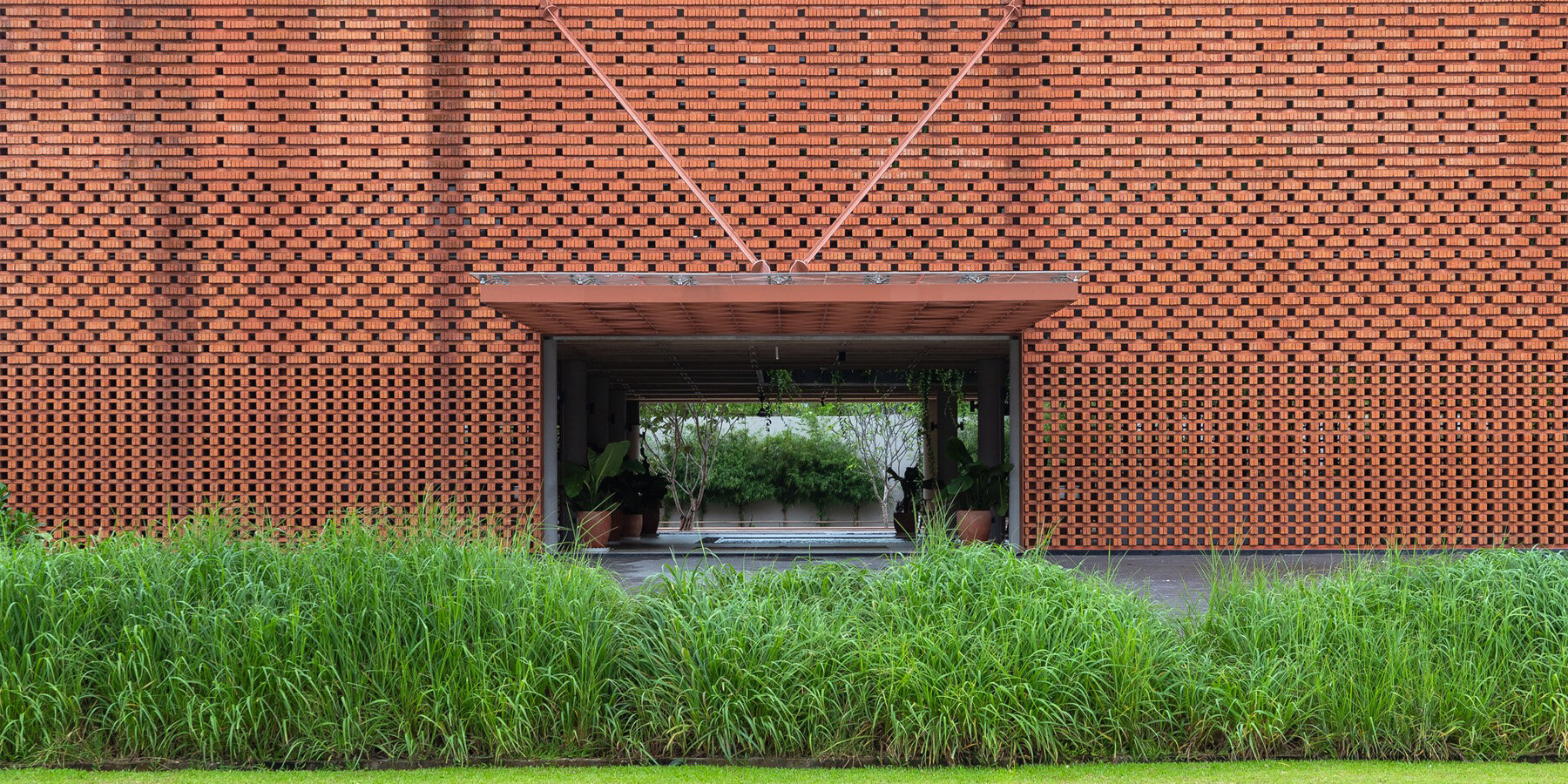 using bare bricks, MIA design studio shapes meditative club house along vietnamese coast