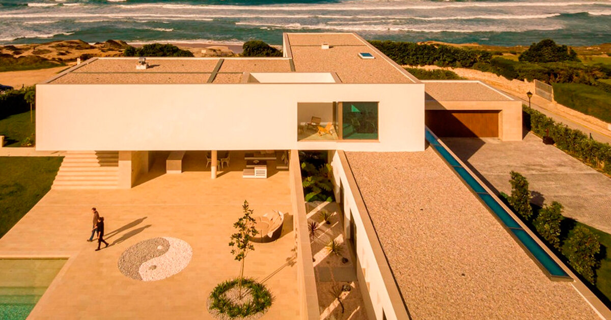 minimalist residence in portugal explores solid and void spaces