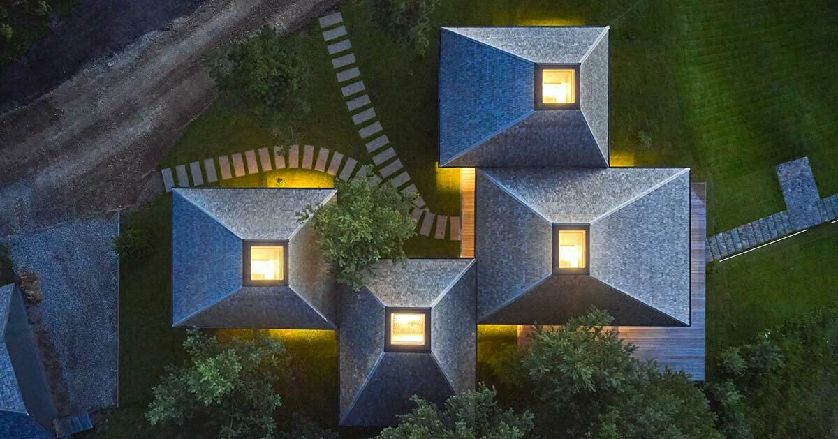 in the picturesque hills of lithuania, a cluster of guest houses by HEIMA gazes skywards