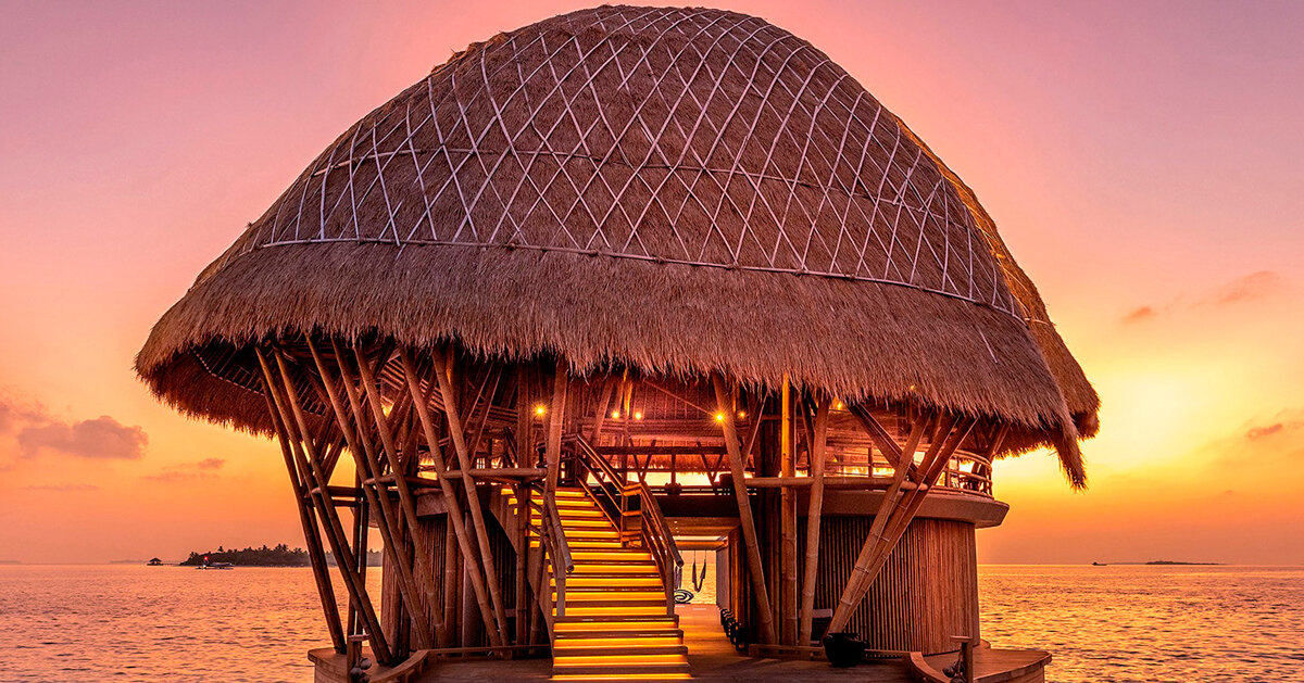 weaved bamboo roofs enclose pavilions for resort in the maldives