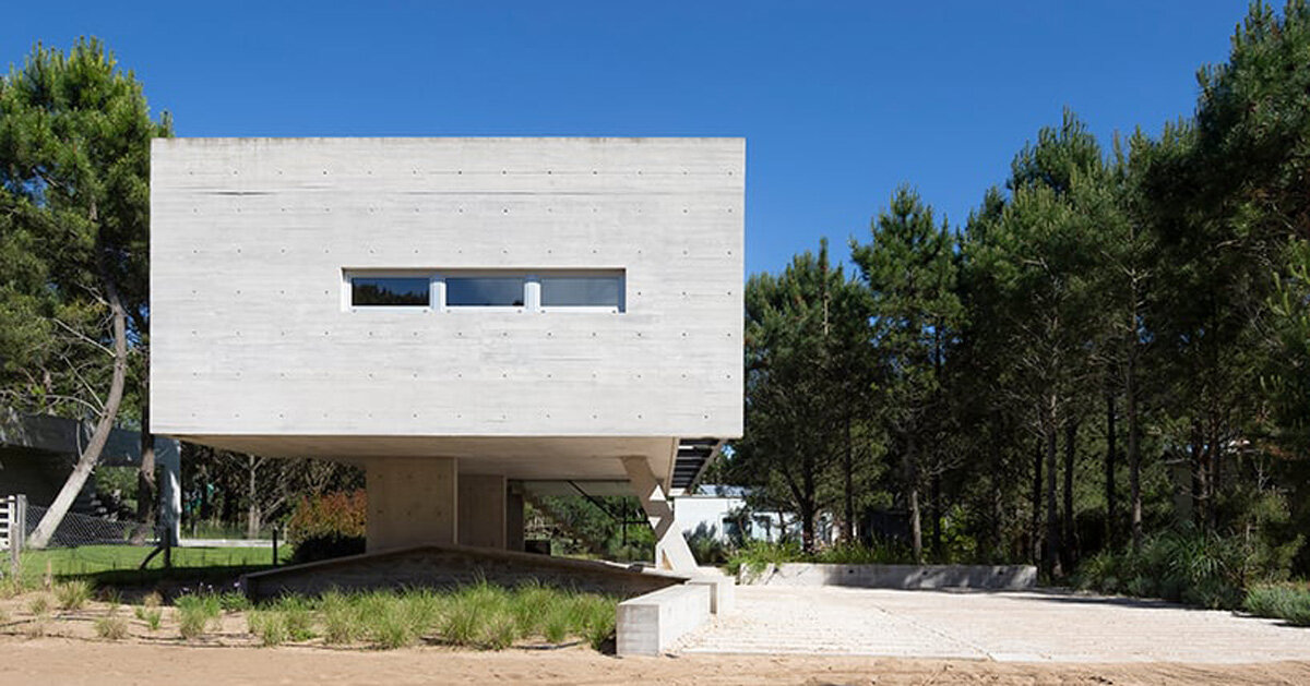 estudio galera rests monolithic home on concrete stilts in argentina