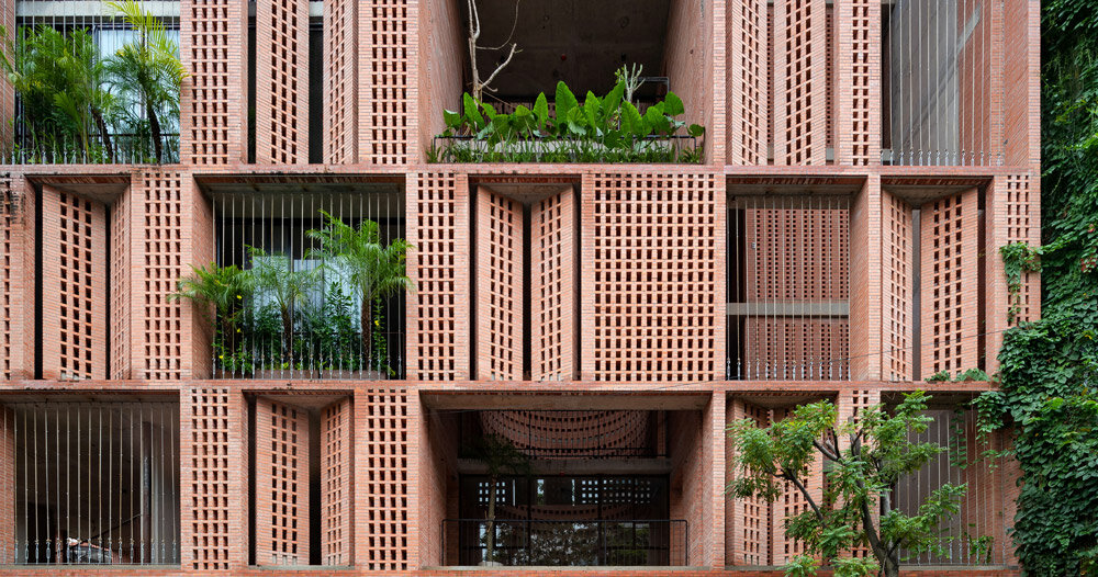 tropical space encloses 'premier office' with a porous brick facade