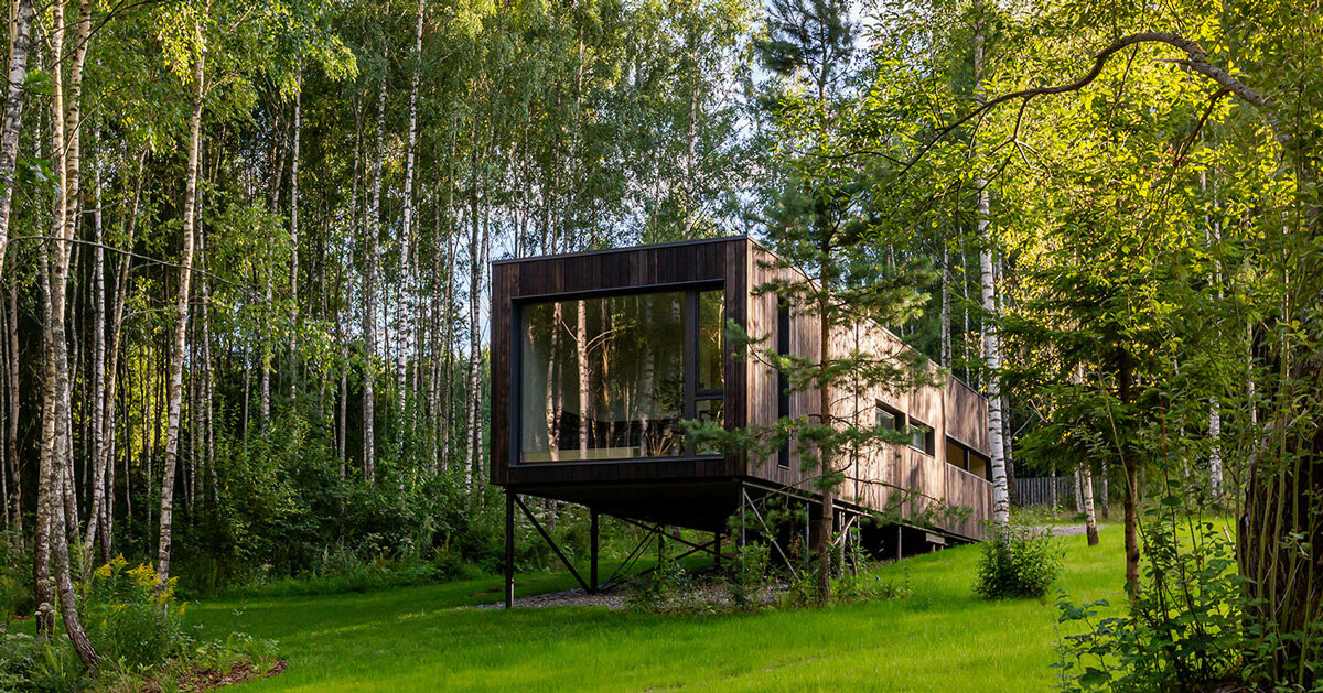 hillside house on stilts by TWO+ preserves natural surroundings