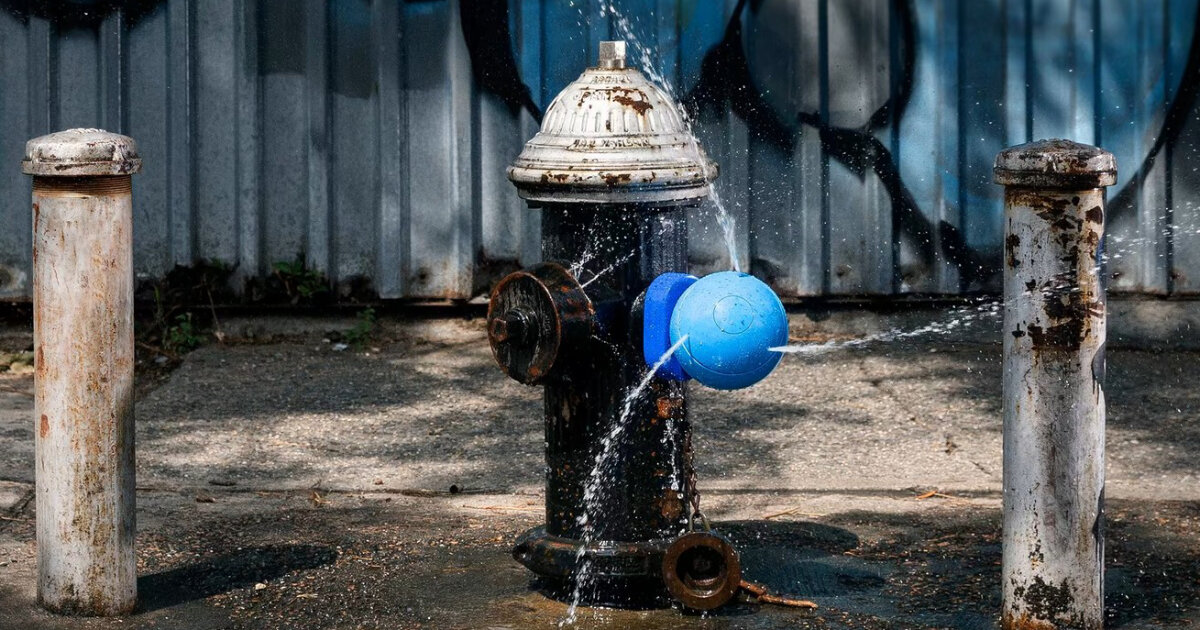 vibrant fire hydrant caps in new york splash water like aqua park