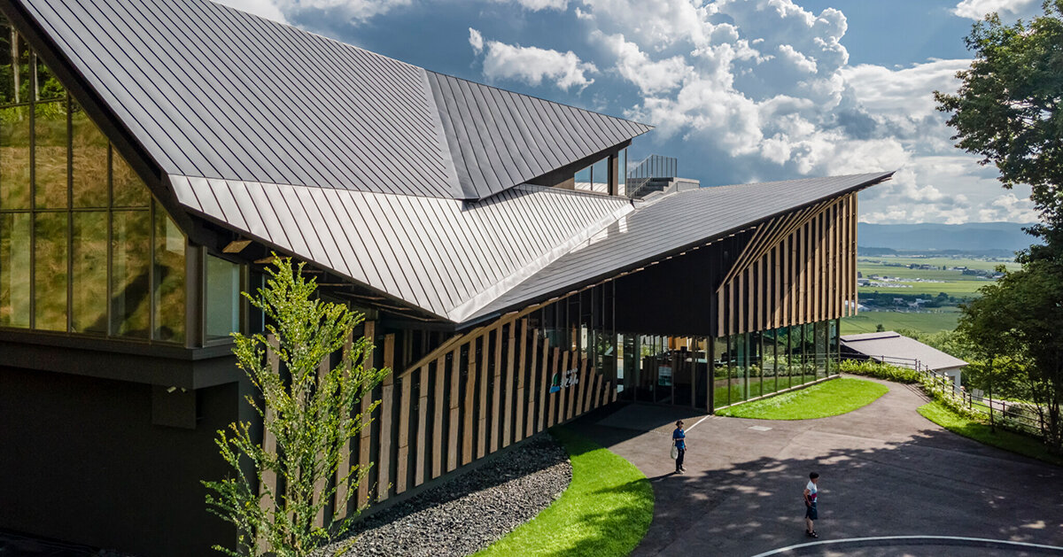 kengo kuma cloaks hot spring resort in hokkaido with locally
