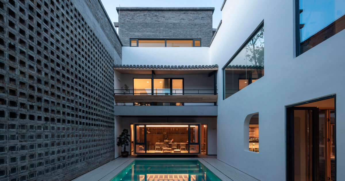 gray brick cladding envelops hotel in chinese ancient village