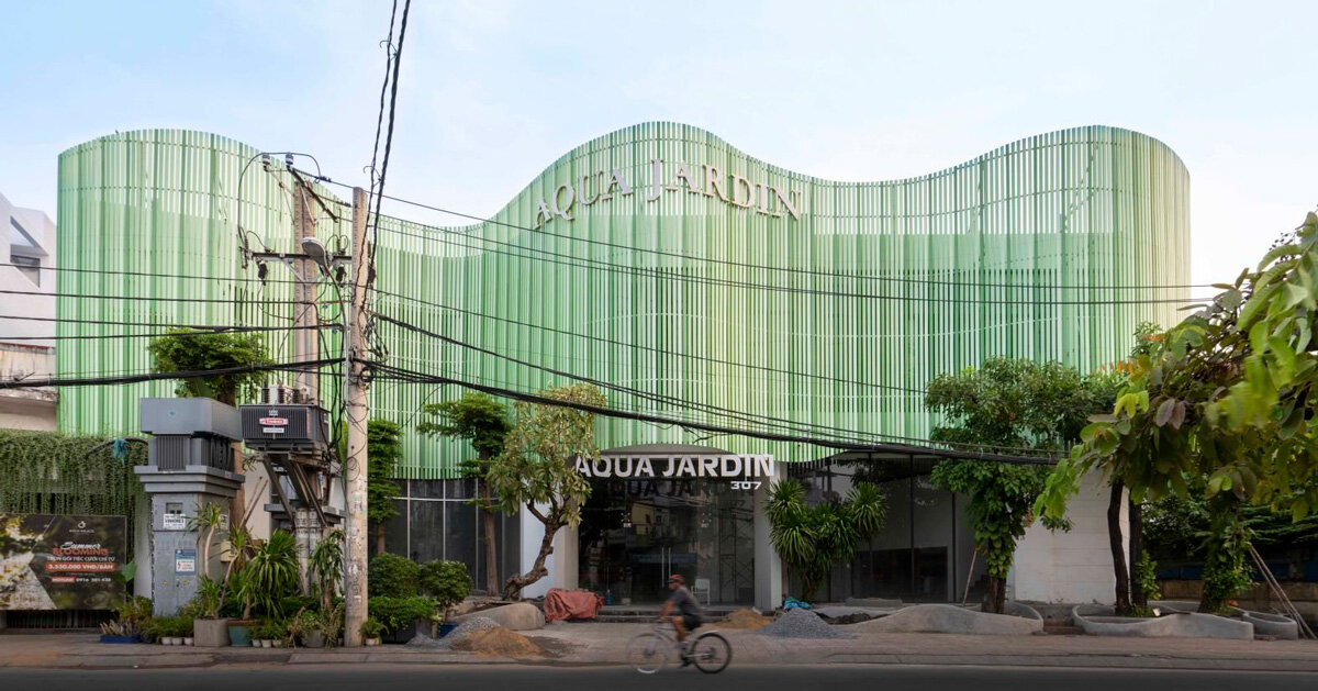 reused wooden panels compose undulating facade for aqua jardin wedding venue in vietnam