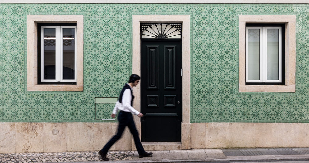 camarim arquitetos restores lisbon house with decorative facade of patterned tiles