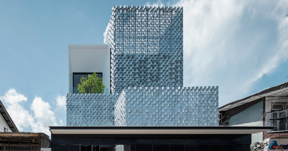 this ‘salient house’ in thailand is surrounded by a glass block fence